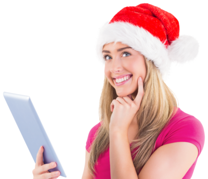 Festive blonde using tablet pc