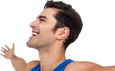 Excited male athlete with arms outstretched