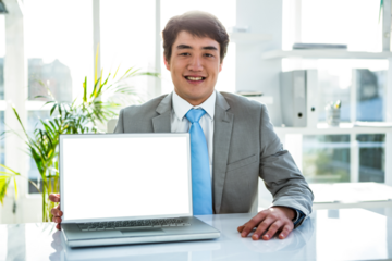 Businessman smiling while showing laptop