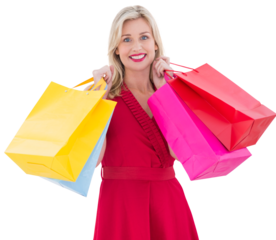 Stylish blonde in red dress holding shopping bags