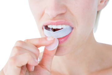 Woman putting her gum shield 
