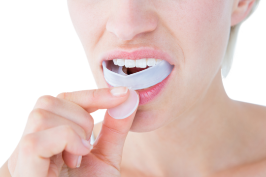Woman putting her gum shield 