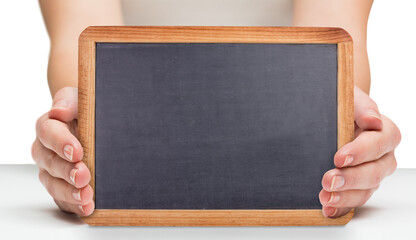 Females hands showing black board