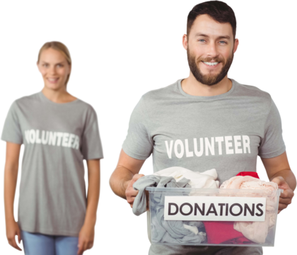 volunteer holding clothes donation box in office