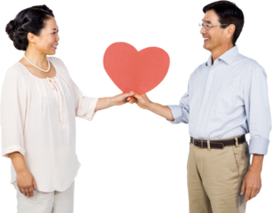 Older asian couple holding heart