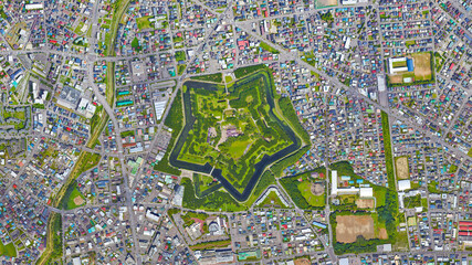 Hakodate City, Goryokaku Park, star castle and water canal looking down aerial view from above –...
