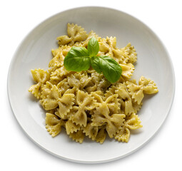 Farfalle pasta (bow tie shape) with pesto, a typical Genoese sauce of basil, pine nuts, olive oil...