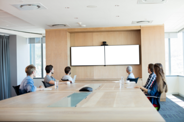 Creative business team attending video call in conference room