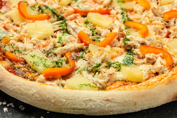 pizza with chicken pineapple and pepper, hawaiian pizza, on a dark background, Restaurant menu, dieting, cookbook recipe top view