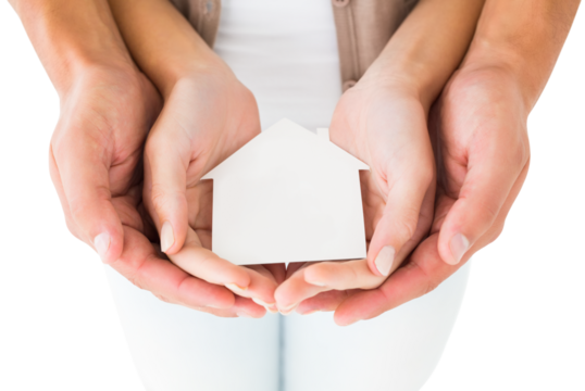 Couple holding miniature house in hands