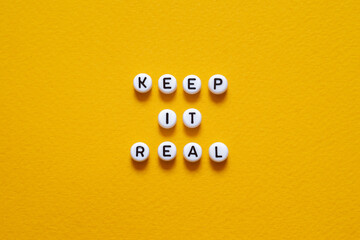 Keep it real - word concept on paper,text