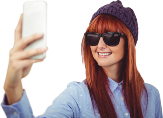 Smiling hipster woman taking selfie