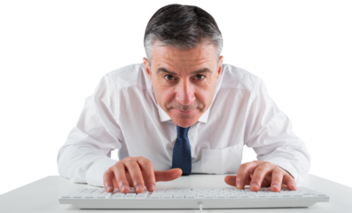 Mature businessman typing on keyboard