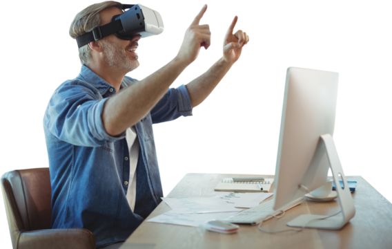 Businessman looking though virtual reality simulator while siting at desk