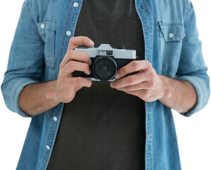Mid section of man holding camera 