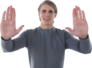 Portrait of smiling young businessman gesturing against white background