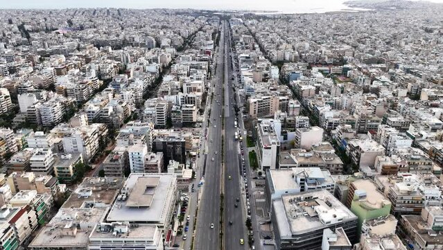 Aerial drone time-lapse video of famous avenue of Syggrou and urban cityscape leading to Athens riviera, Attica, Greece