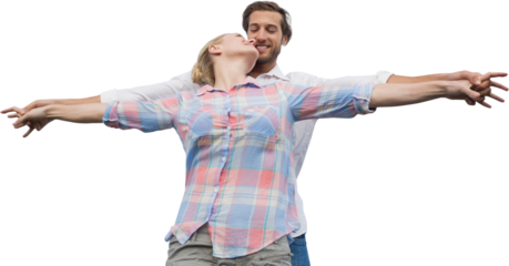 Man and woman standing with arms outstretched