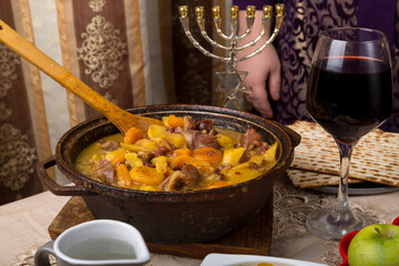 A woman at the table set for the Passover Seder.