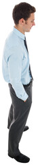 Happy businessman standing with hand in pocket
