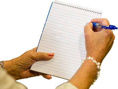 Woman hand writing on note pad with pen
