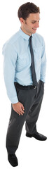Happy businessman standing with hand in pocket