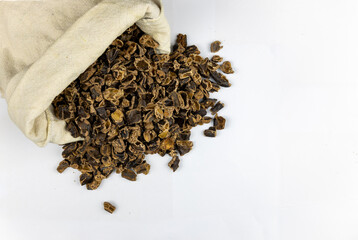 Raw Carob Kibble Nibbles, Top View Isolated on a White Background, for Snacks and Healthy Eating