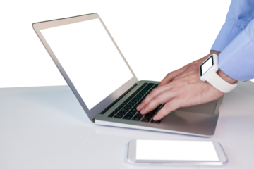 Cropped hands of businessman using laptop