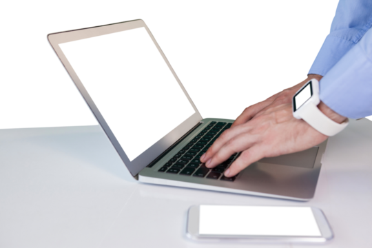 Cropped hands of businessman using laptop