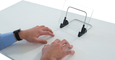 Cropped hands of businessman typing on imaginary keyboard while using glass interface