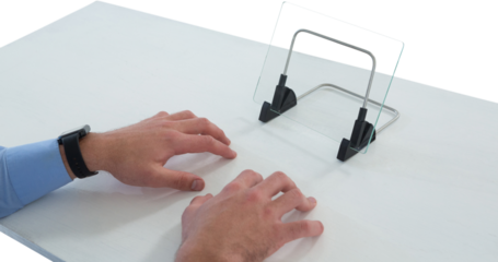 Cropped hands of businessman typing on imaginary keyboard while using glass interface