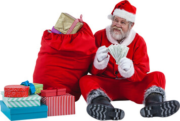 Santa Claus sitting by Christmas gifts and counting currency notes