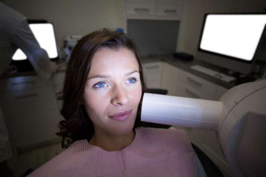 Female patient receiving dental treatment