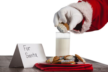 Cropped image of Santa Claus dipping cookies in glass of milk