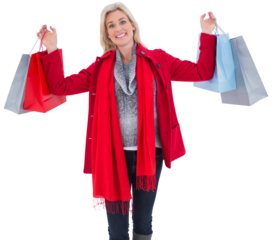 Blonde in winter clothes holding shopping bags