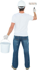 Rear view of man using paint roller