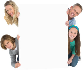 Family holding blank billboard and peeking