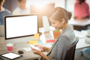 Happy businesswoman using smart phone