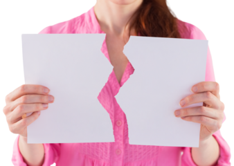 Woman holding torn sheet of paper