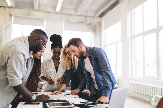Diverse creative business people working in office