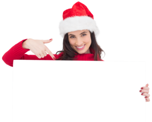 Pretty brunette in santa hat pointing white poster