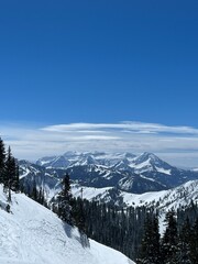 Wasatch Mountains of Utah, timpanogos, from Brighton Ski Resort, in 2023, the year of record snow pack, snow capped mountain peaks