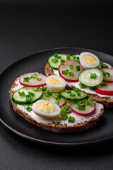 Delicious sandwich or bruschetta with cream cheese radish and green onions
