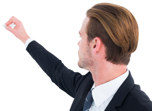 Well dressed businessman writing with chalk