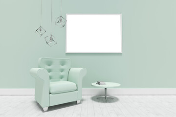 Green armchair by table against blank picture frame 