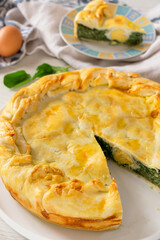 Pasqualina pie, a traditional Italian Easter pie stuffed with spinach, ricotta and eggs.