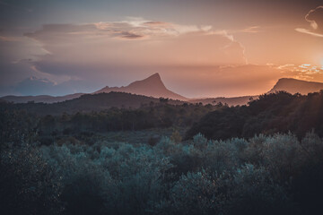 Sunset over the Pic Saint-Loup and the Hortus cliff near Montpellier in the south of France - obrazy, fototapety, plakaty