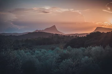 Foto op Aluminium Sunset over the Pic Saint-Loup and the Hortus cliff near Montpellier in the south of France © Nicolas VINCENT