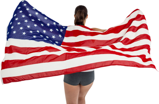 Rear view of woman holding American flag - Powered by Adobe