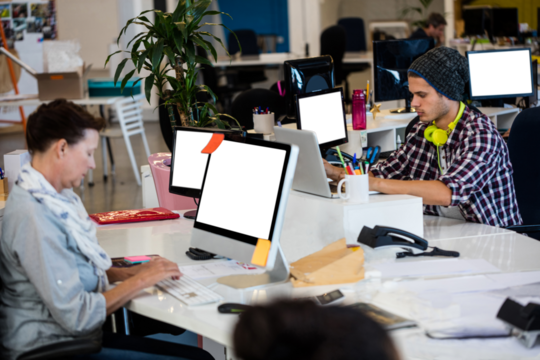 Man and woman working on computer